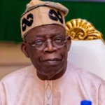Tinubu-on-brown-dress-640x345