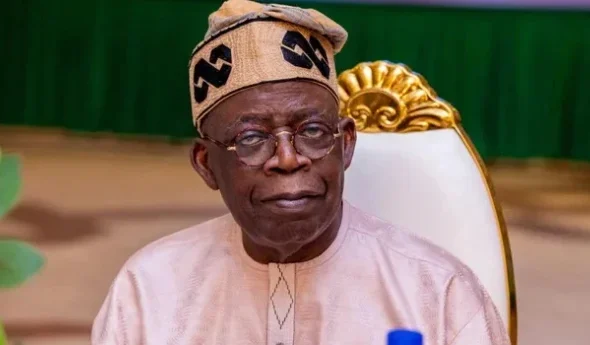 Tinubu-on-brown-dress-640x345